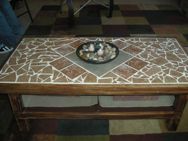 a table top made out of broken rustic tiles
