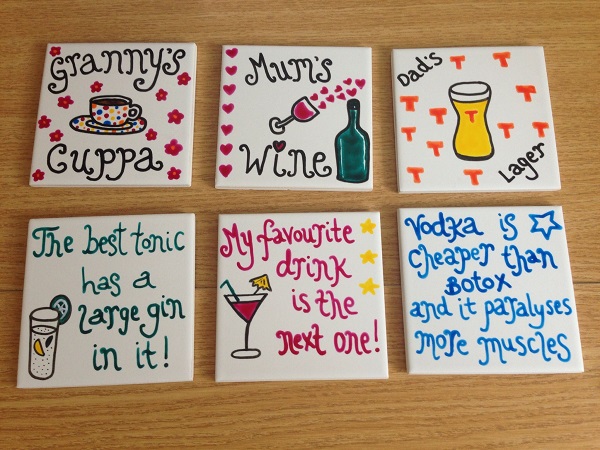 Painted tile coasters on a table
