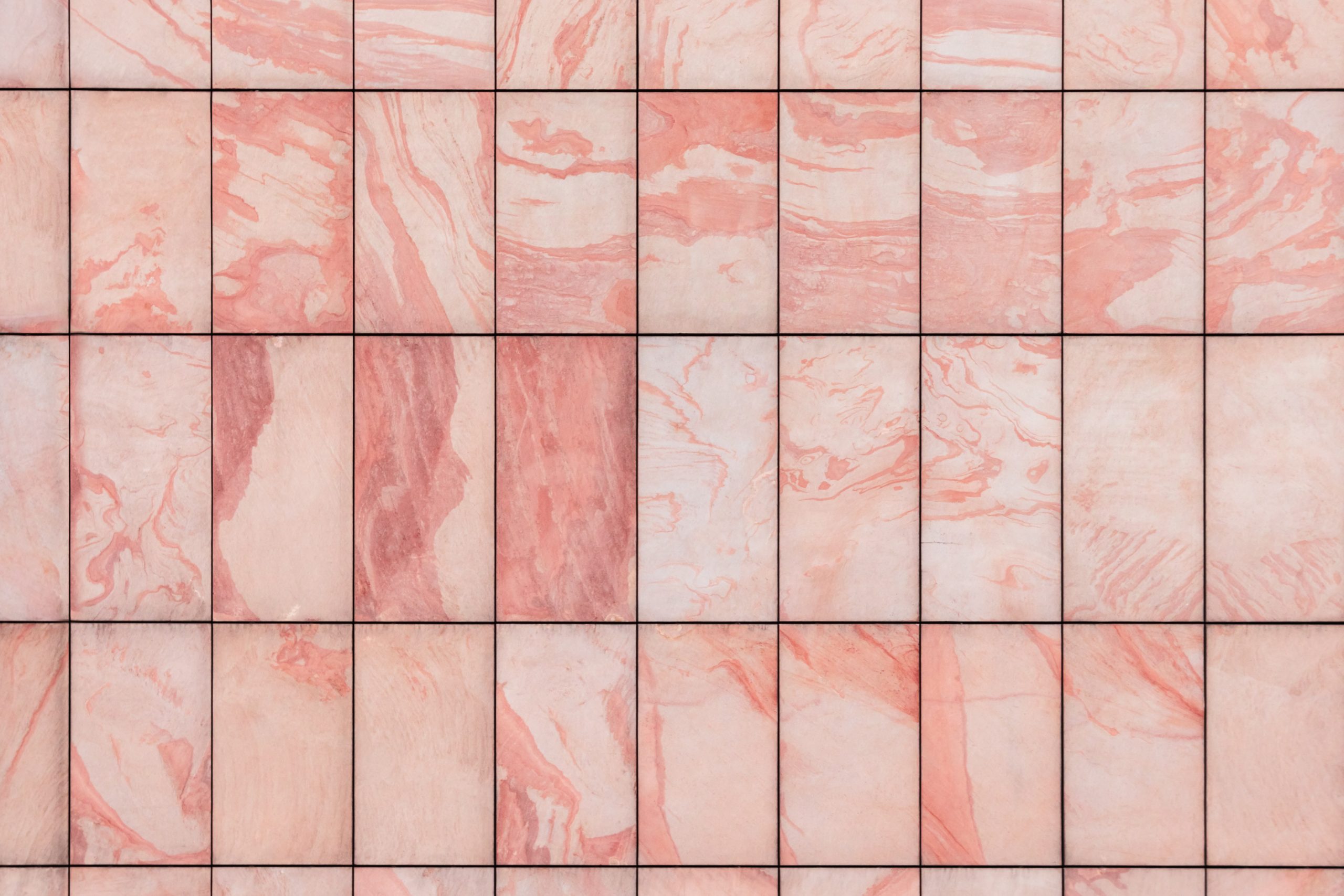 A picture of pink and white marble titles.