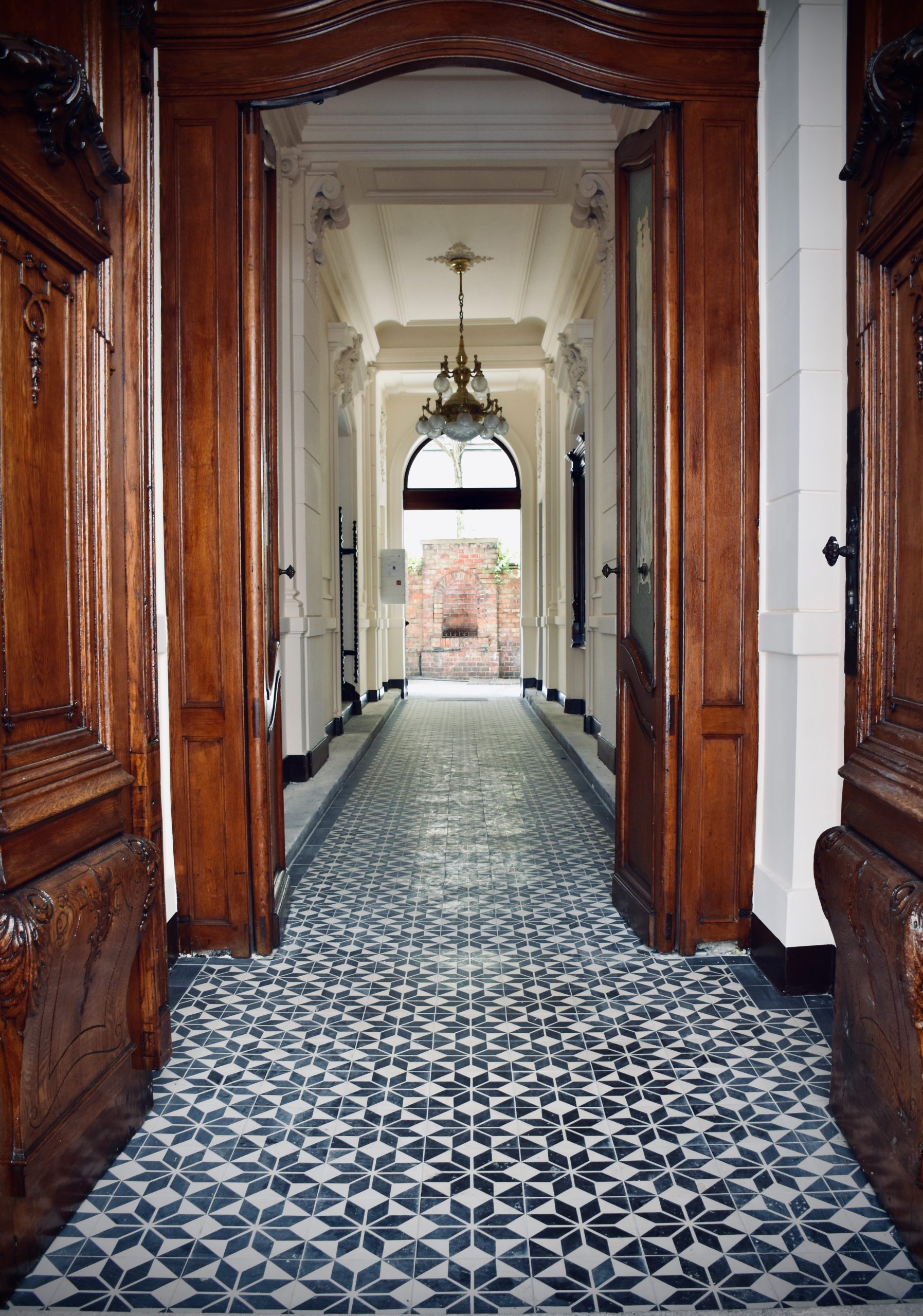 Hallway with tiles as the floor